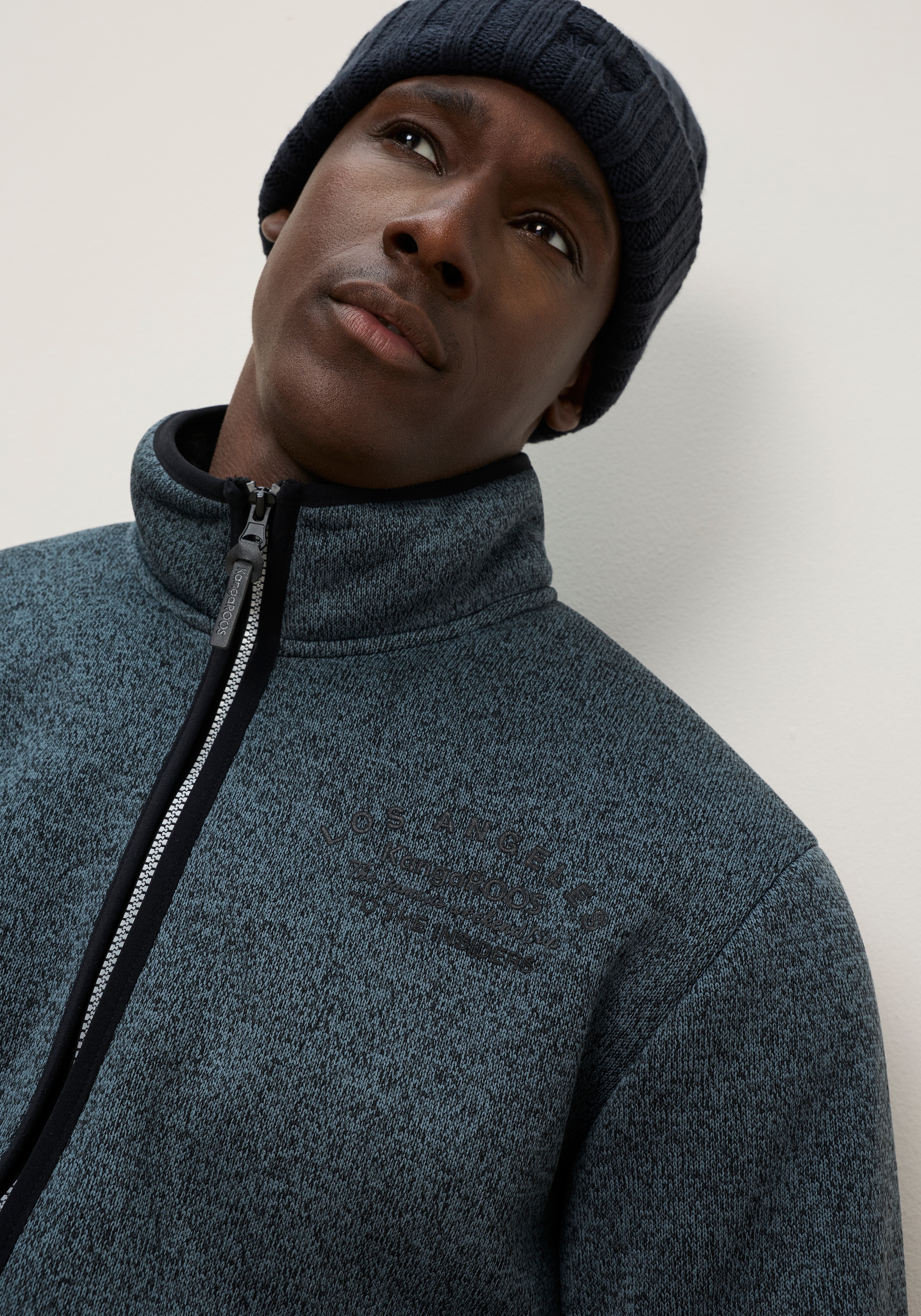 KangaROOS Strickfleecejacke mit durchgehendem Reissverschluss, po-bedeckende Länge
