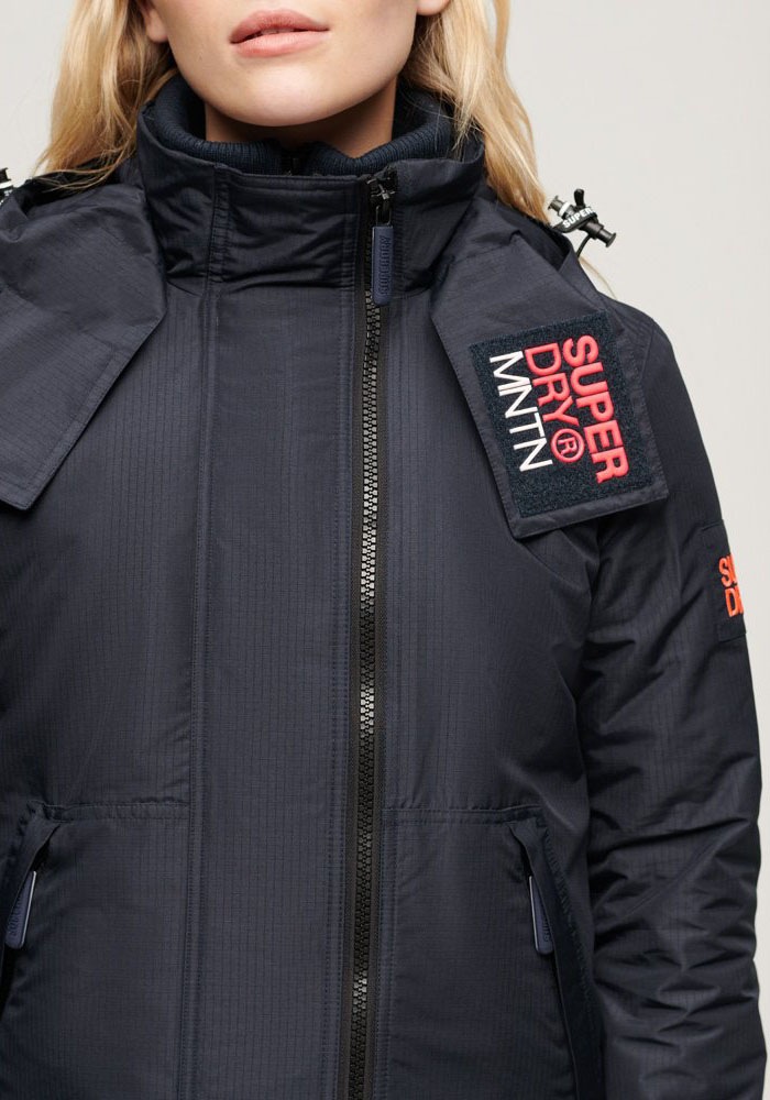 Superdry Veste d'extérieur »HOODED MTN WINDBREAKER JACKET« mit Kapuze