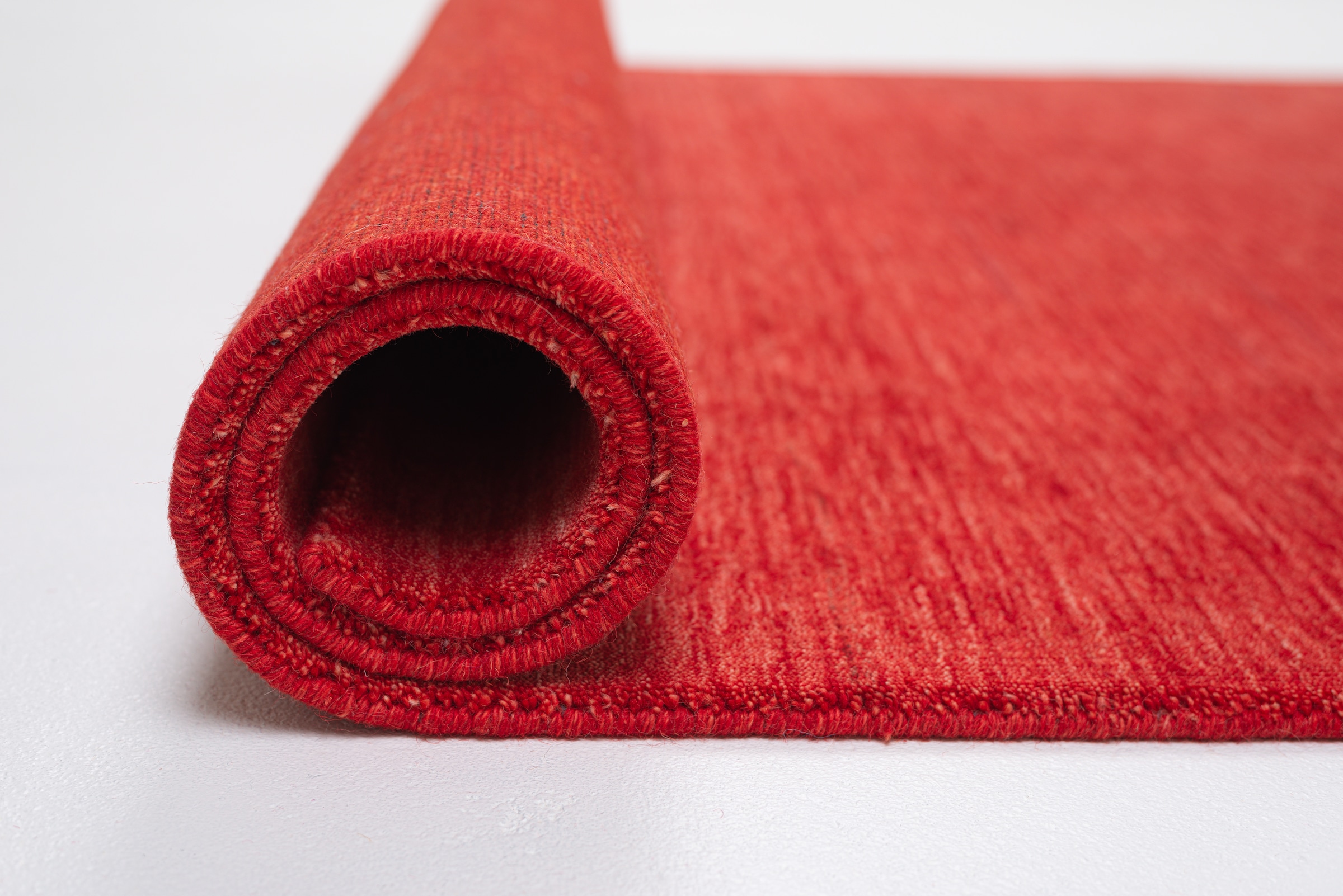 THEKO Tapis en laine »Holi« Rectangulaire 13 mm Höhe Uni-Farben, leicht meliert, reine Wolle, handgewebt mit Knüpfoptik