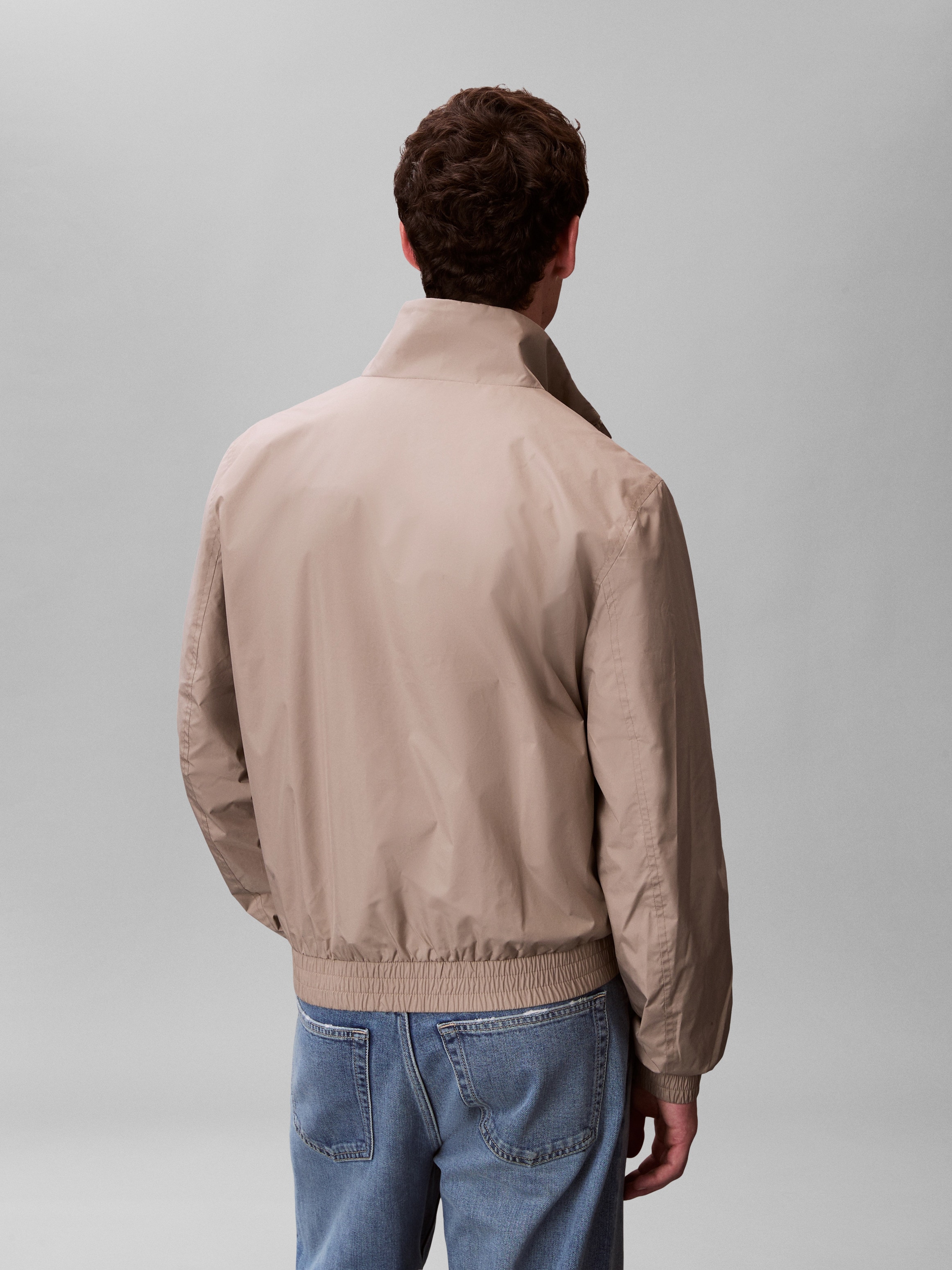 Calvin Klein Coupe-vent »UNFILLED NYLON« sans capuche coupe régulière avec col montant