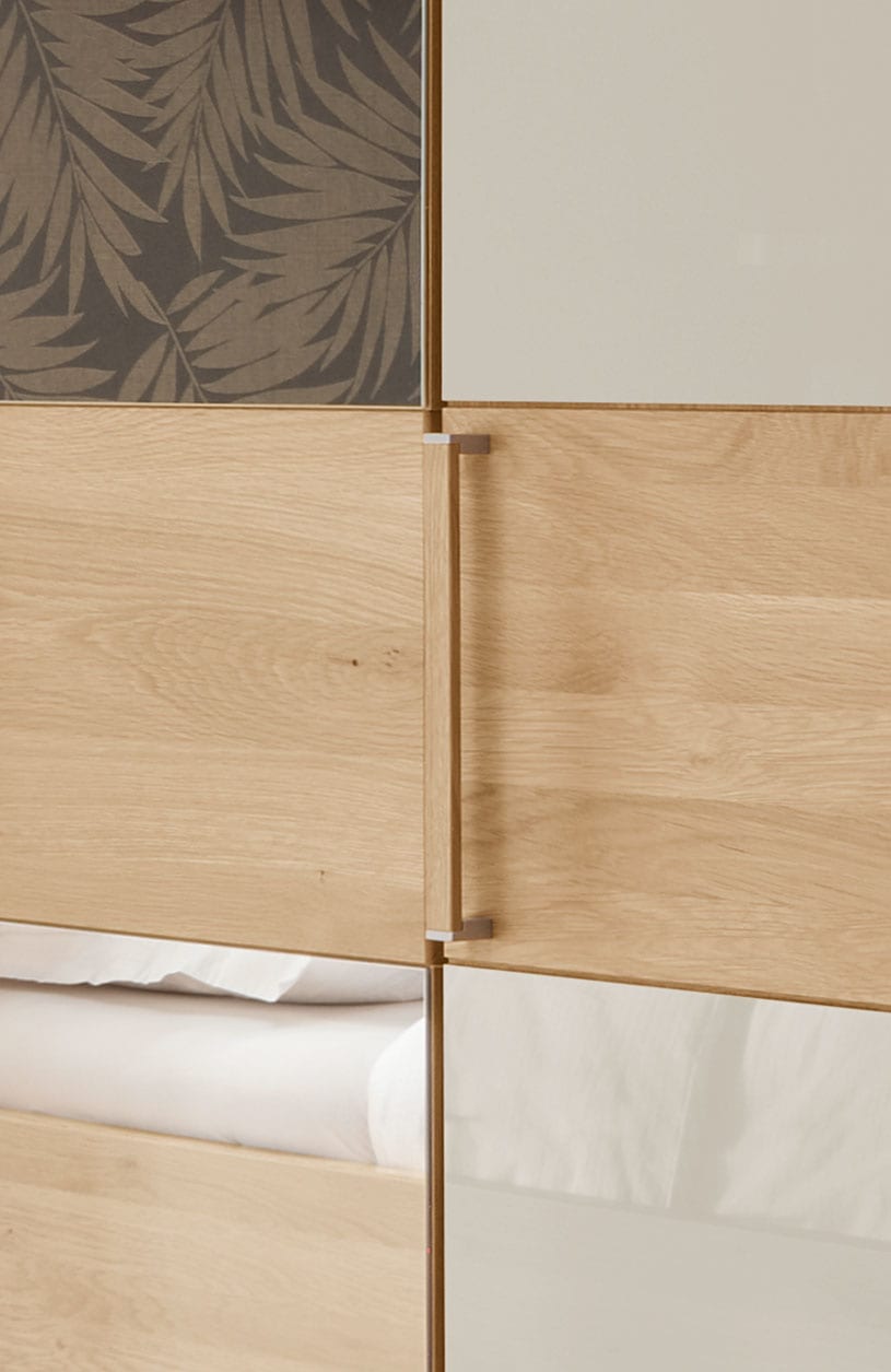 WIEMANN Drehtürenschrank »Kiruna« mit Champagnerglas und Spiegel