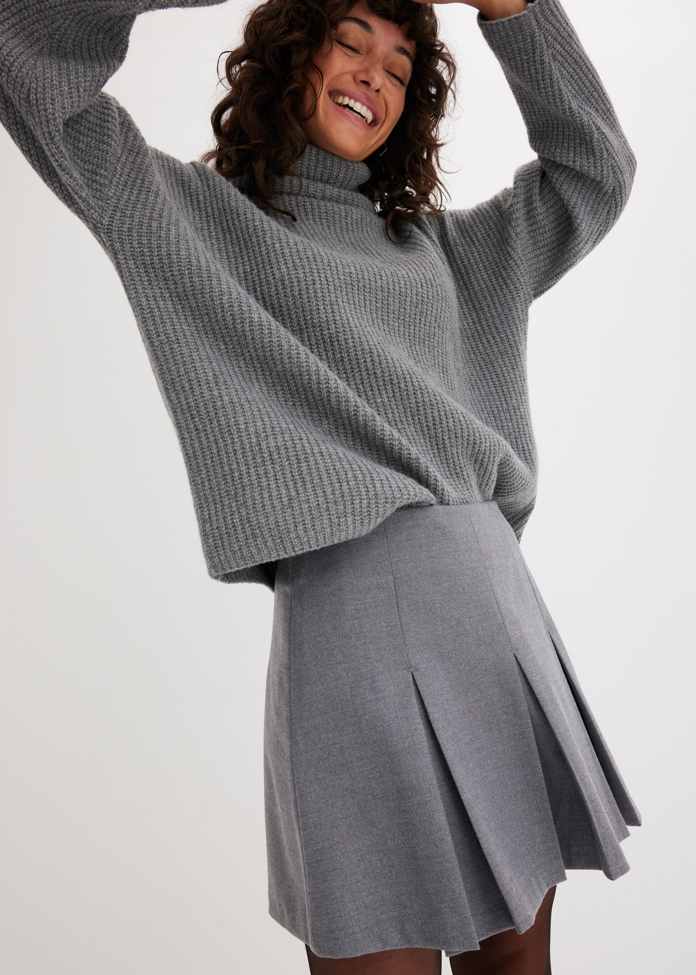 bonprix Minirock aus Viskose-Mix, figurbetonte Passform, Faltenrock-Design