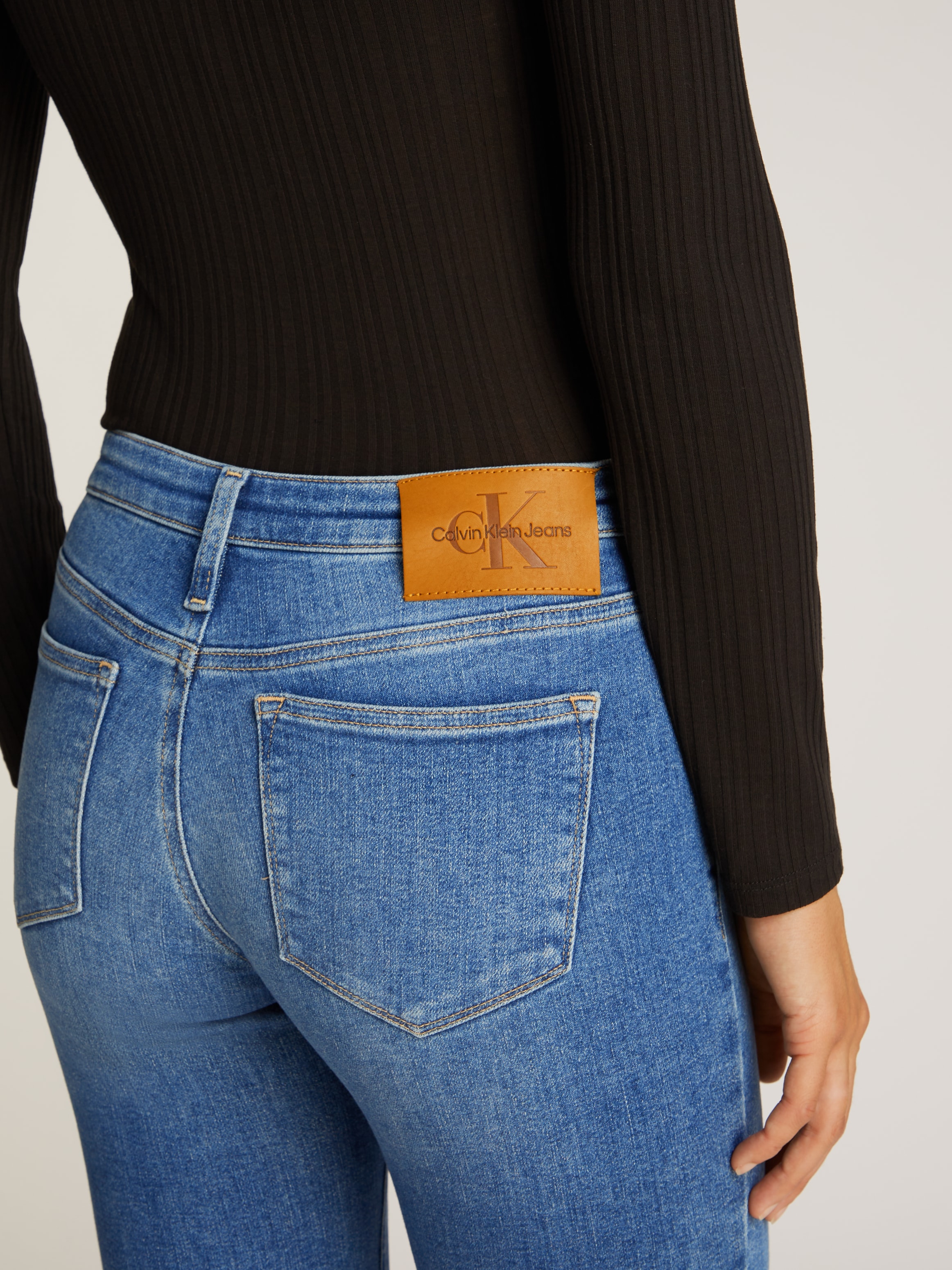 Calvin Klein Jeans Skinny-fit-Jeans »MID RISE SKINNY«, mit stoned wash Optik, mit Coinpocket