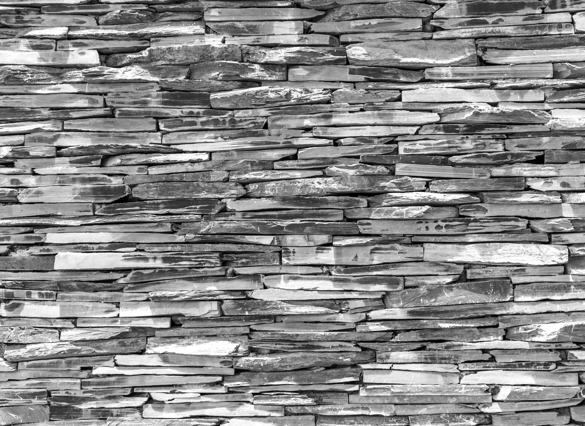 Papermoon Fototapete »Steinwand Schwarz & Weiss«