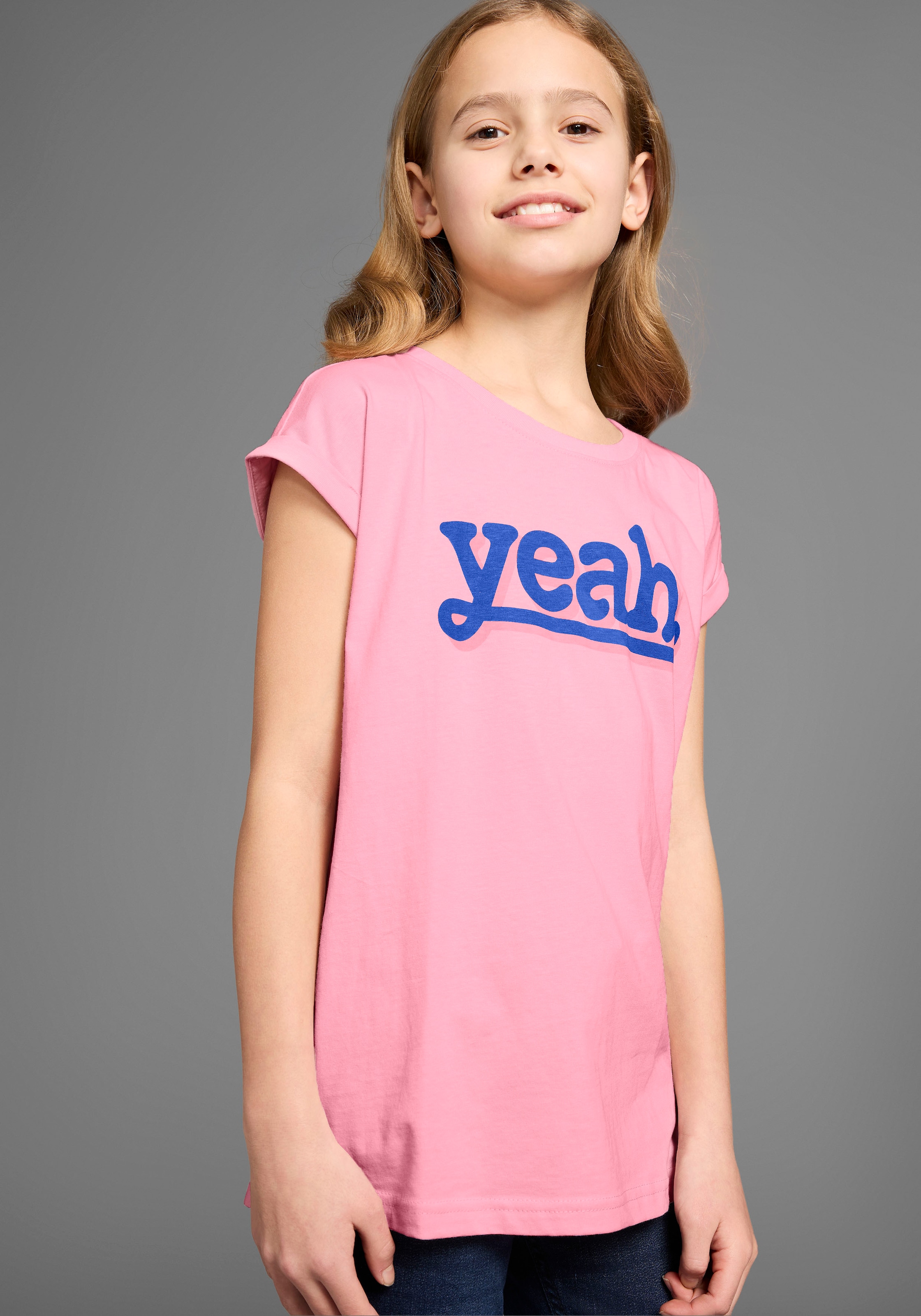 KIDSWORLD T-Shirt »Sprücheshirt mit überschnittener Schulter«, T-Shirt "YEAH" print