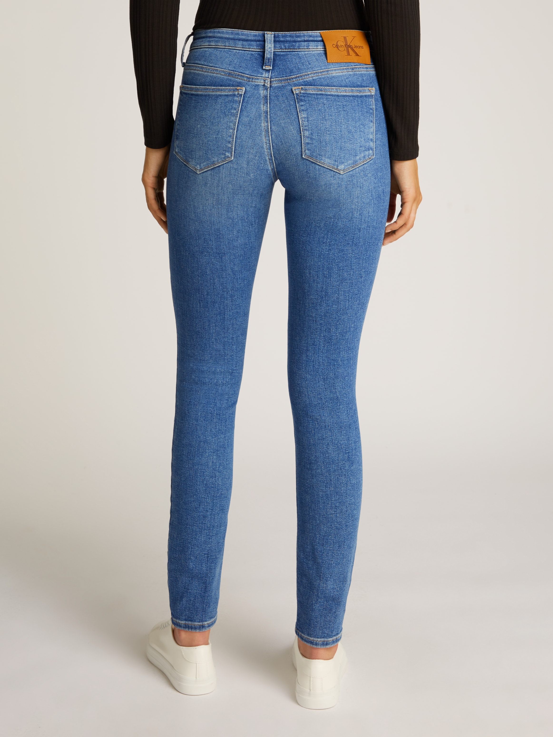 Calvin Klein Jeans Skinny-fit-Jeans »MID RISE SKINNY«, mit stoned wash Optik, mit Coinpocket