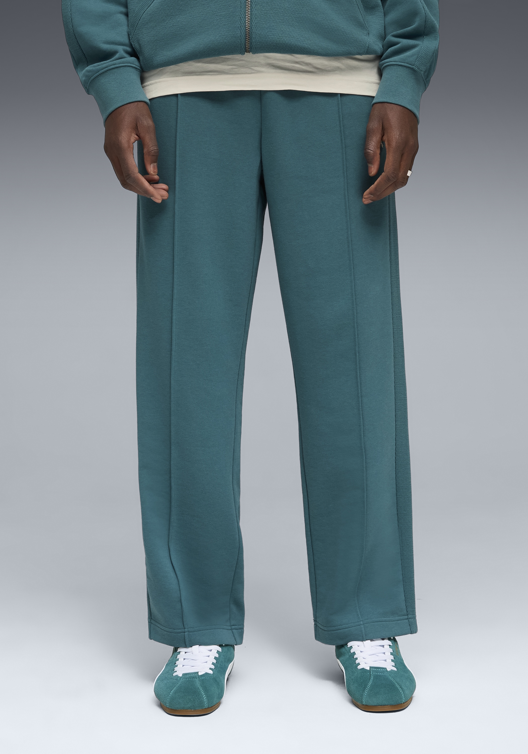 PUMA Trainingshose "CLASS RELAXED PINNACLE TRACK PANTS TR" mit Eingrifftaschen, sportlicher Stil