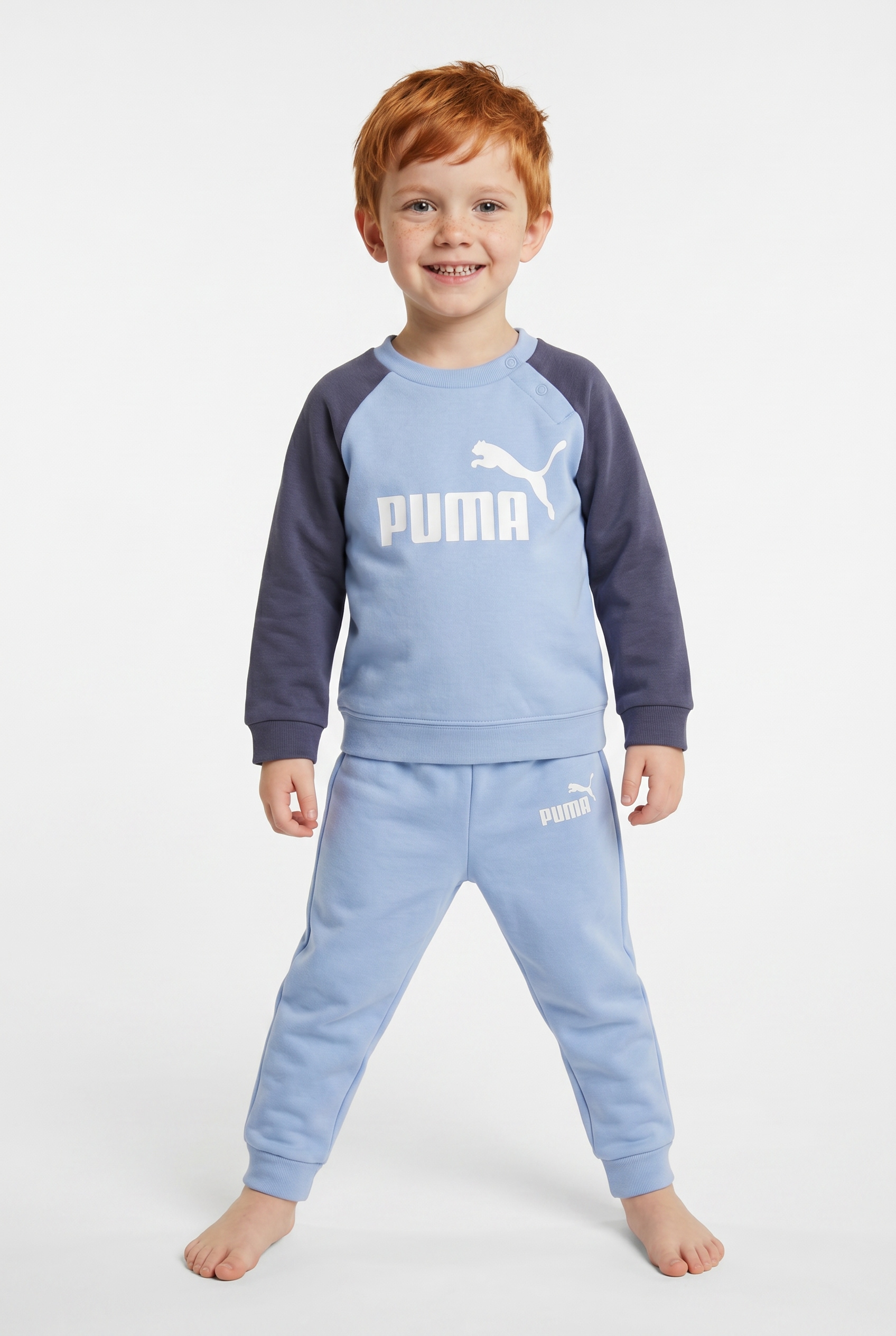Puma Chambray Blau Trainingsanzug "Minicats Ess Raglan Crew Set Fl Inf" 2 2-Teilig, Mit Rundhalsausschnitt, Mit Innenliegendem Kordelzug