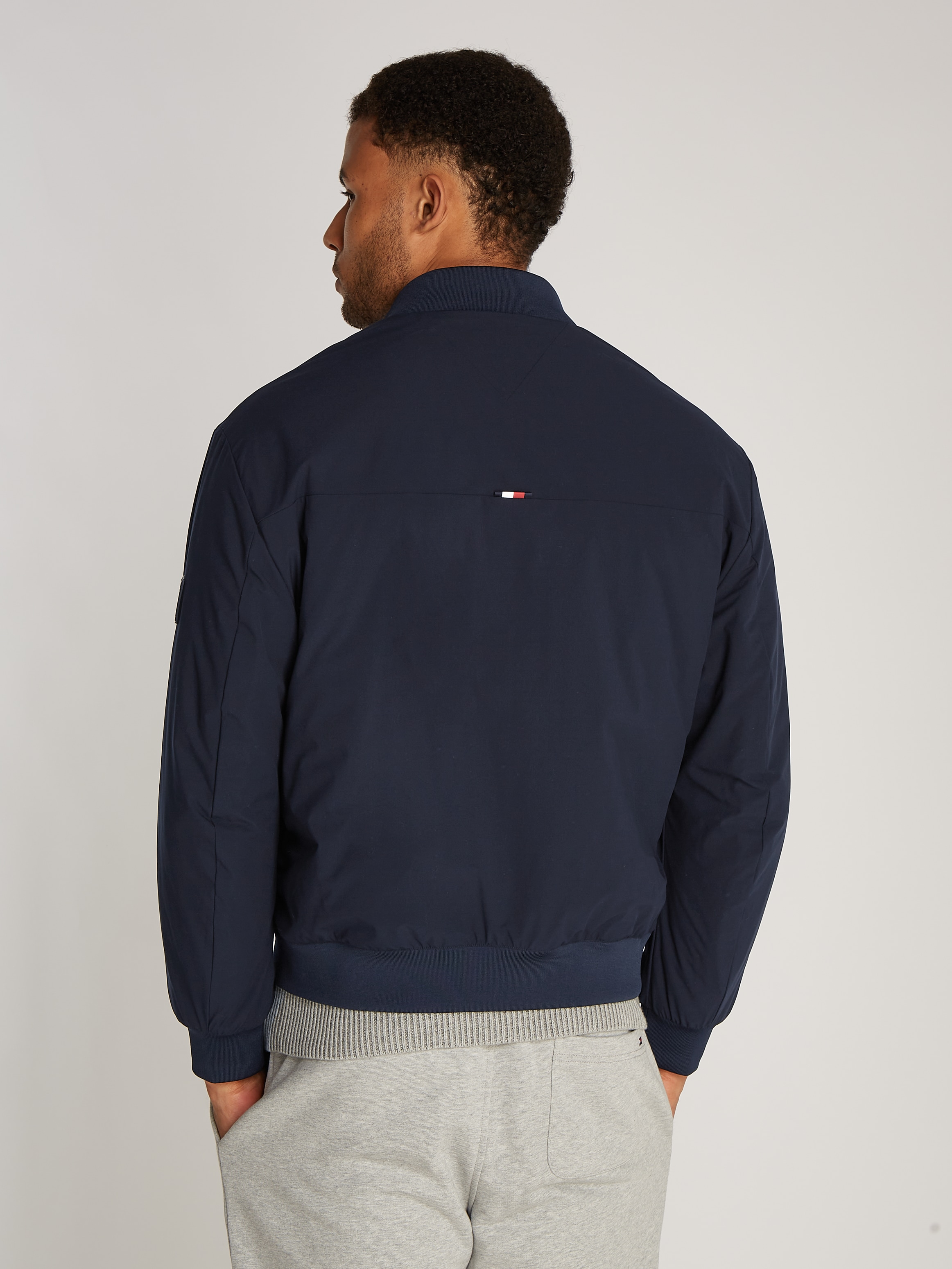 Tommy Hilfiger Bomberjacke »TECH BOMBER«, mit wasserabweisendem Reissverschluss