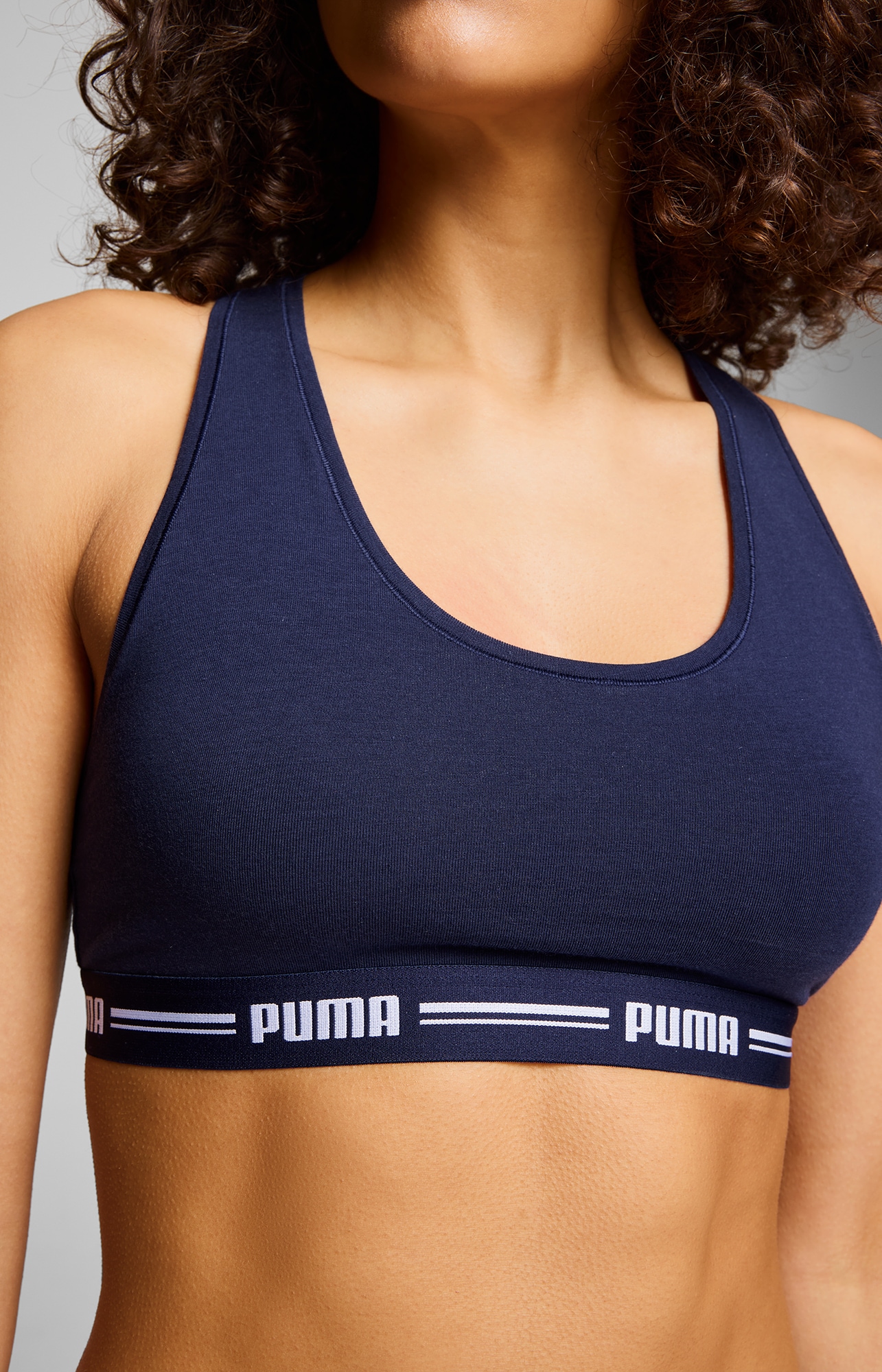 PUMA Sport-Bustier »PUMA WOMEN RACER BACK TOP 1P HANG«, mit markantem Logobund