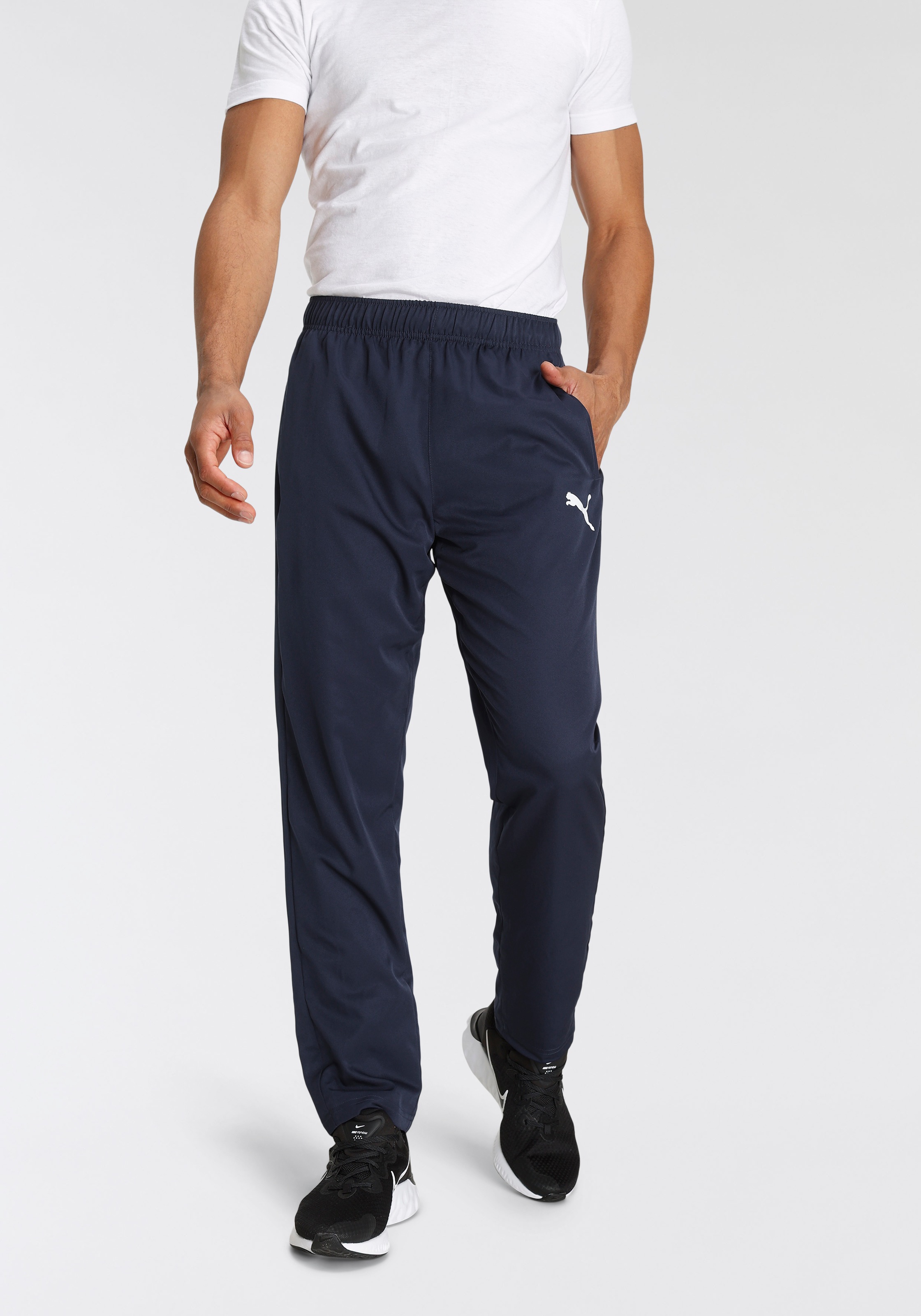 PUMA Trainingshose »ACTIVE WOVEN PANTS OP SRL« sportlicher Stil, für Erwachsene, mit Nahttaschen, atmungsaktiv