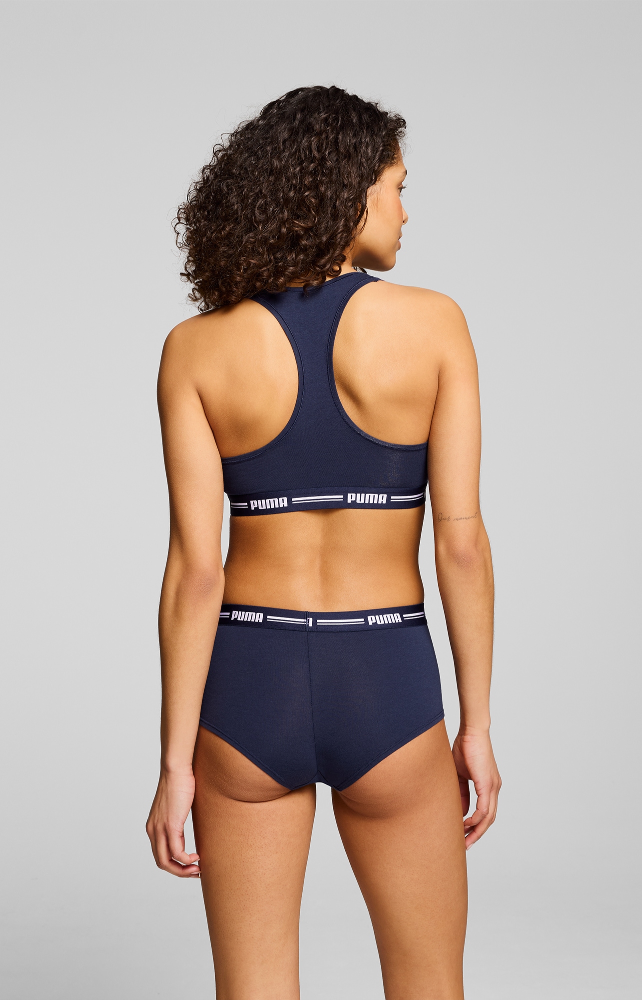 PUMA Sport-Bustier »PUMA WOMEN RACER BACK TOP 1P HANG«, mit markantem Logobund