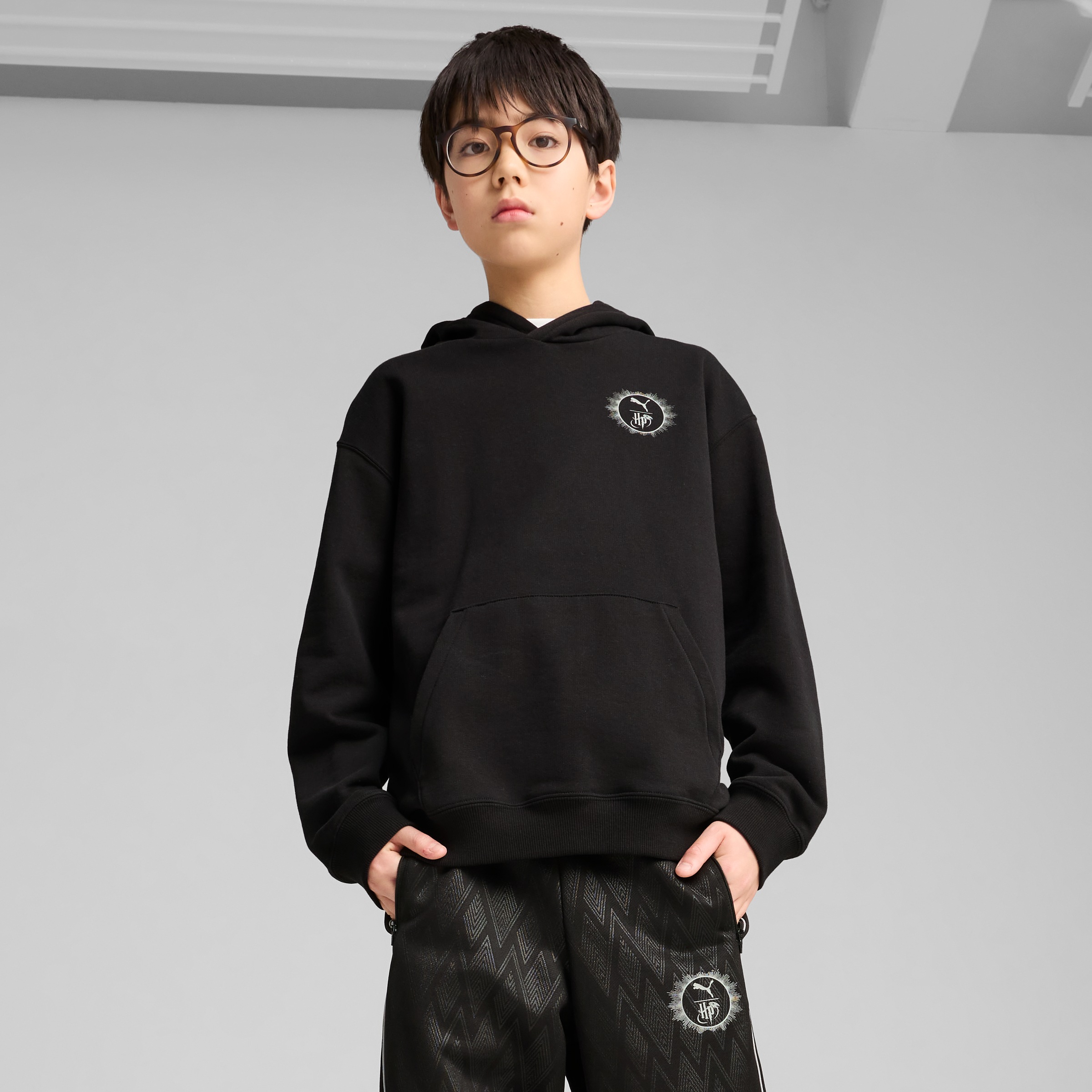 PUMA Kapuzensweatshirt "X HARRY POTTER RELAXED GRAPHIC HOODIE TR", mit Kängurutasche, mit gerippten Bündchen und Saum