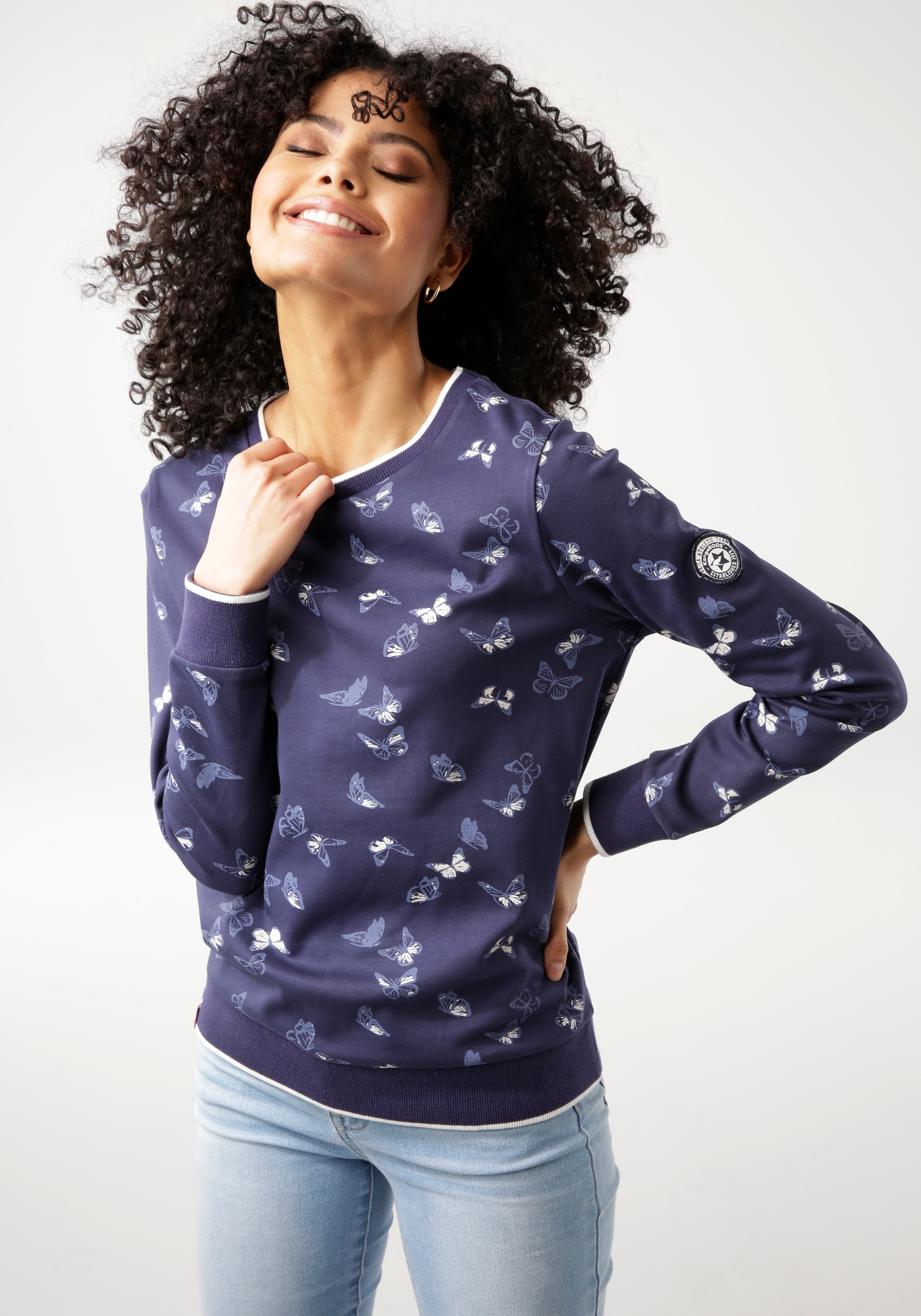 KangaROOS Sweatshirt, bei Schweiz shoppen Schmetterlings-Allover-Druck trendigem mit Jelmoli-Versand online